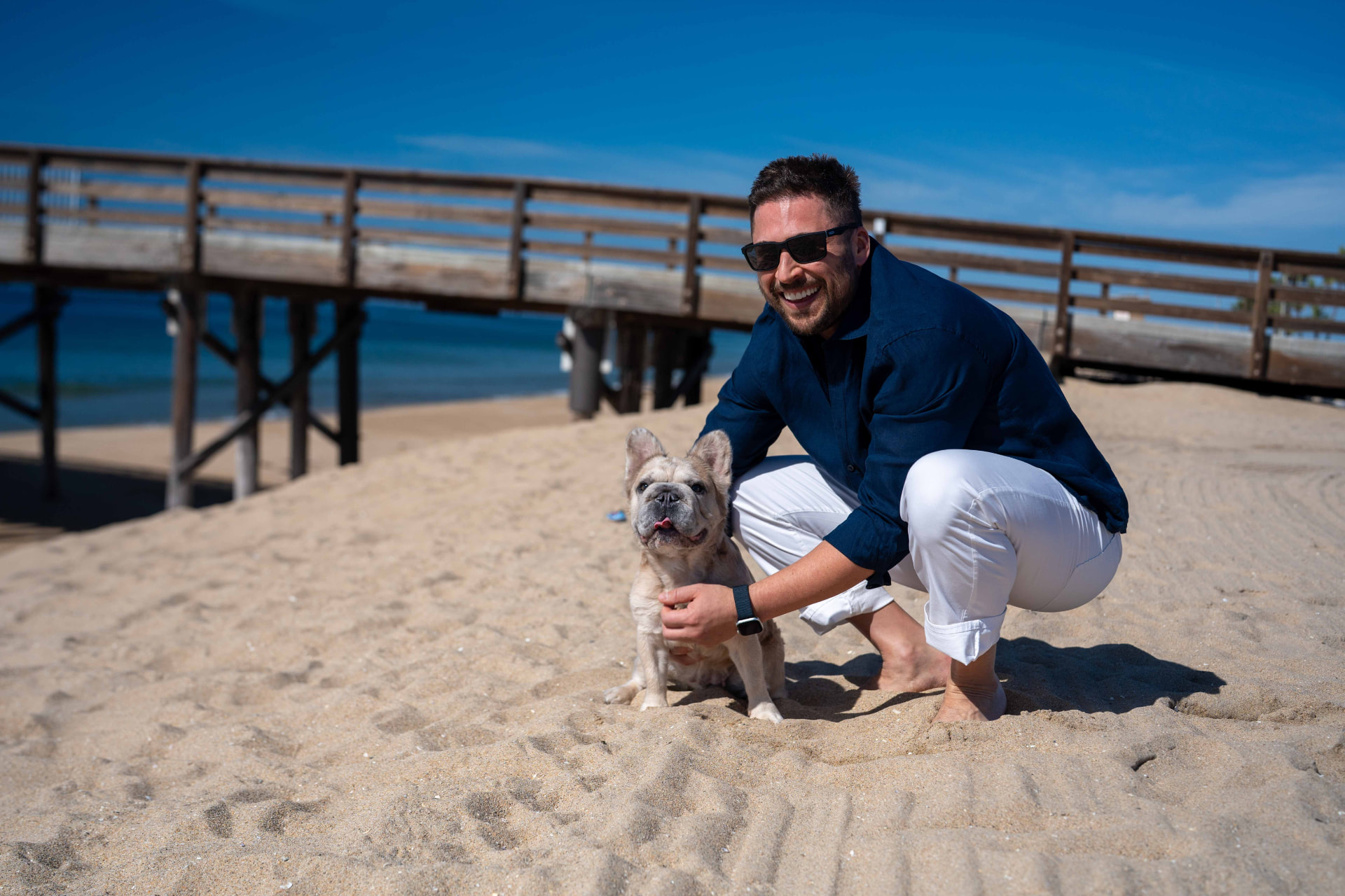 Neil Anders and his dog on the beach